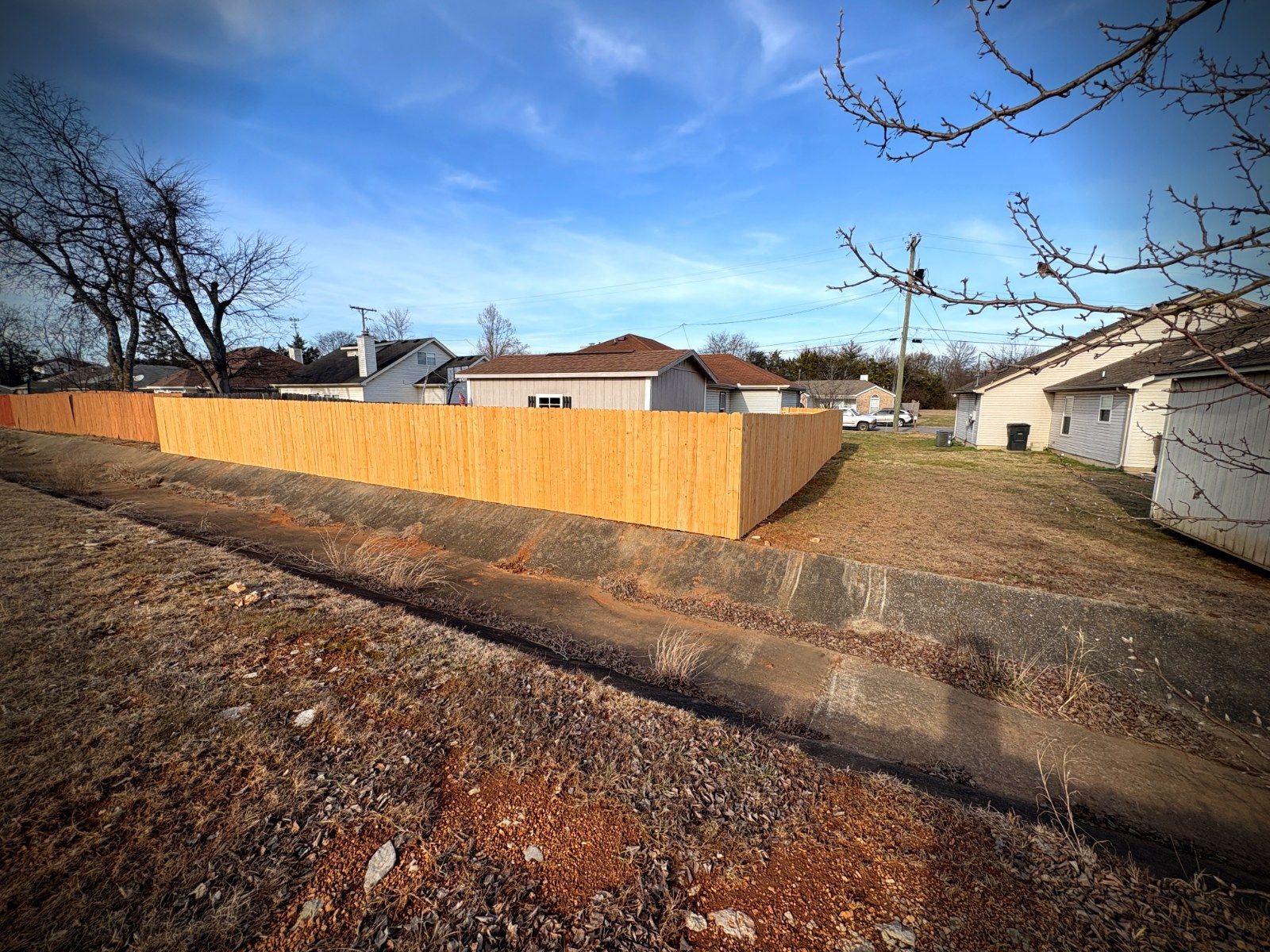 Privacy fence along drainage easement